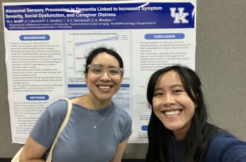 Lab members in front of research poster at annual CCTS conference