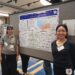 Kennedy and Andrea pose in front of poster at Markey Cancer Research Day